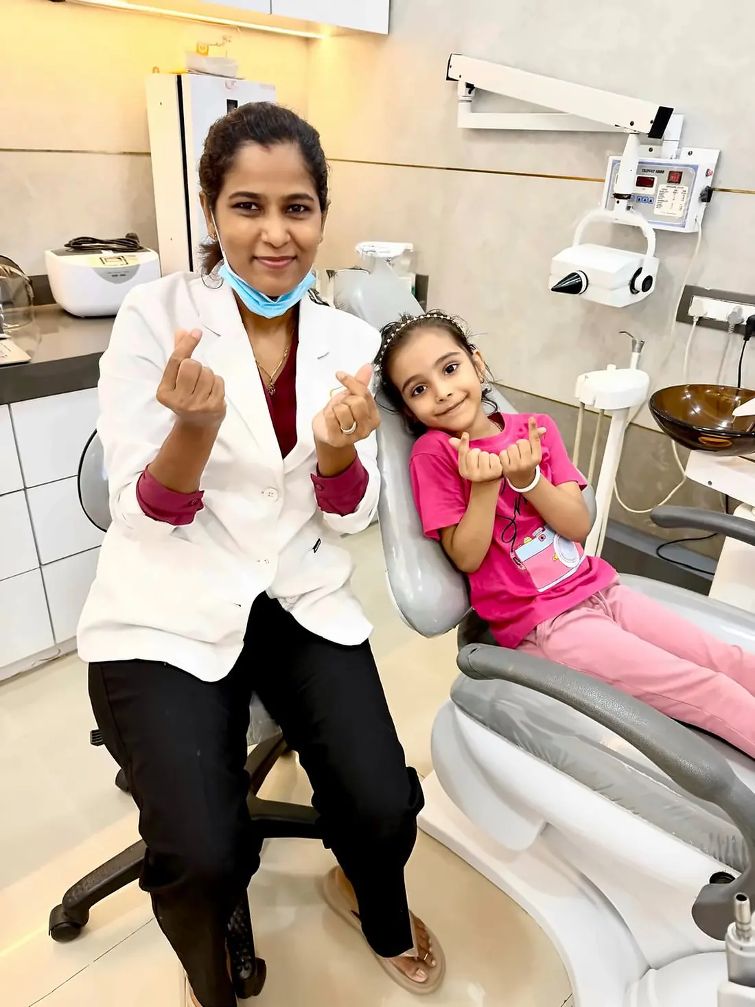 Dr. Supriya Holkar with a young patient on the dental chair