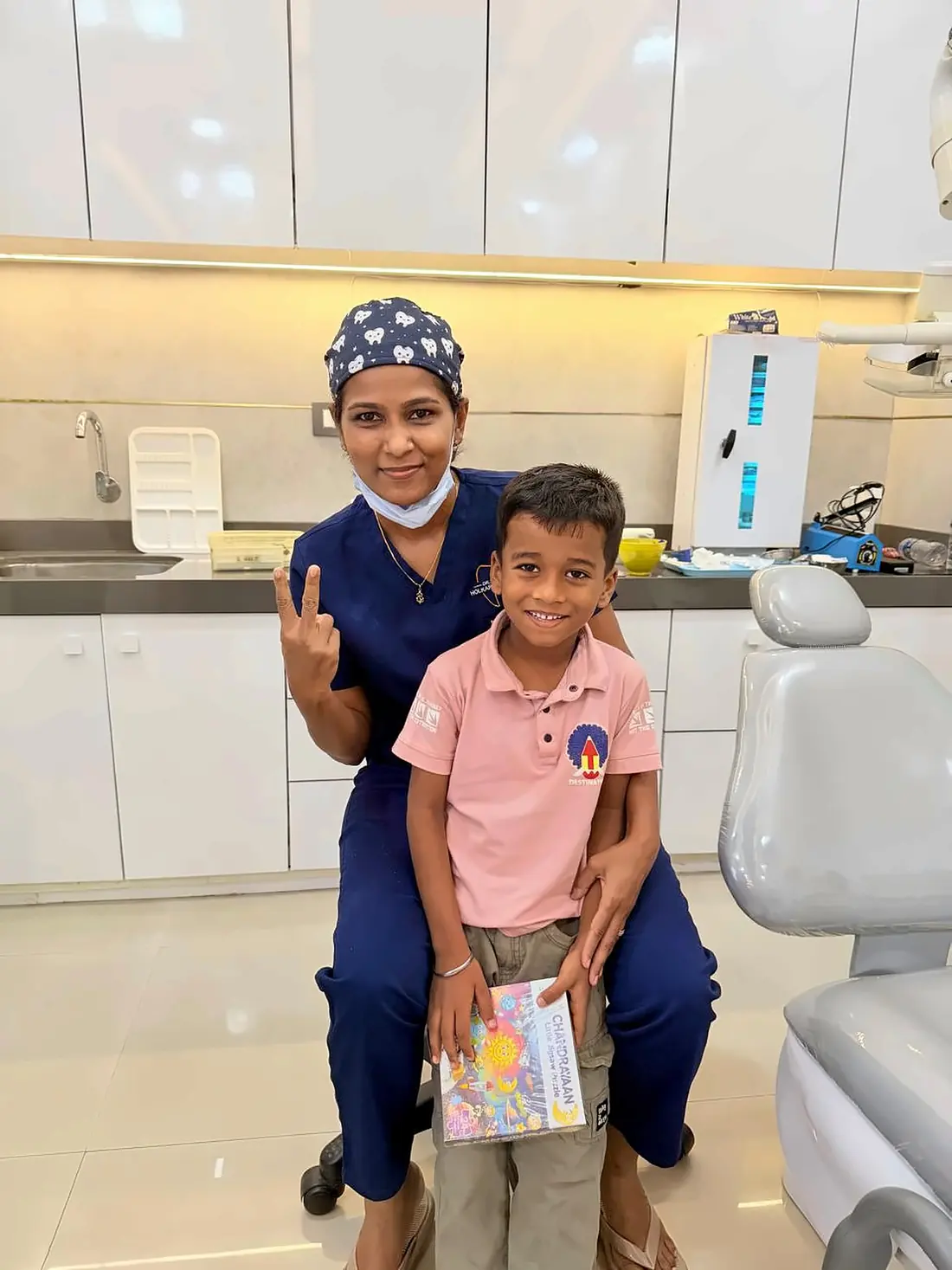 Dr. Supriya Holkar with a young boy at the clinic